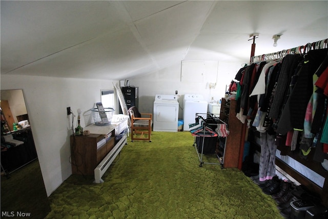 interior space featuring separate washer and dryer, vaulted ceiling, and carpet floors