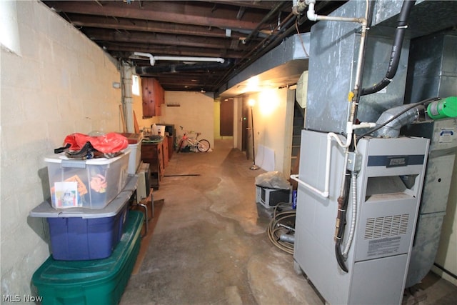 basement featuring heating unit