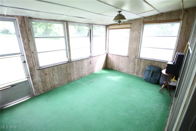 unfurnished sunroom with plenty of natural light and lofted ceiling