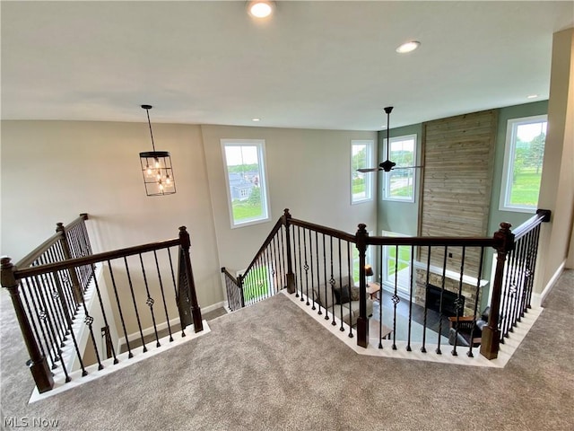 stairway featuring recessed lighting, carpet flooring, and baseboards