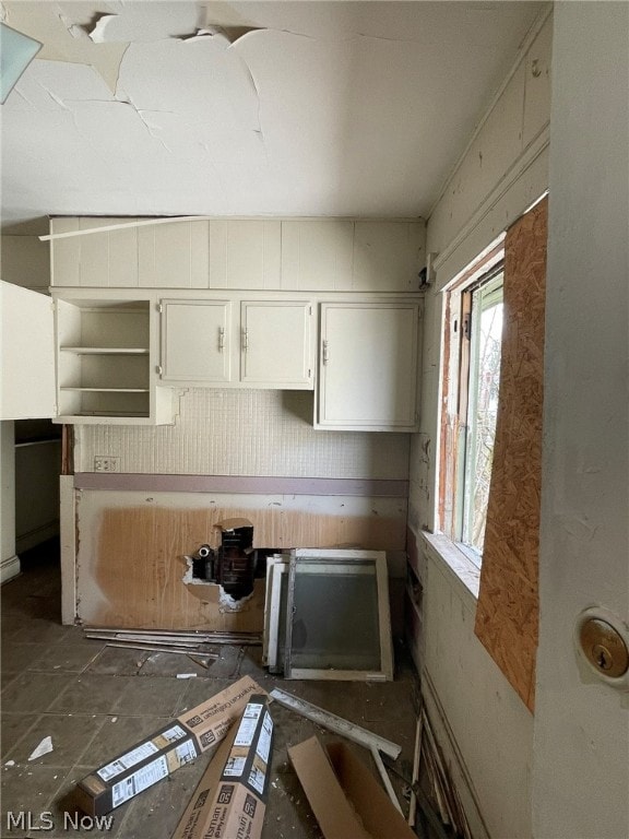 kitchen featuring white cabinets