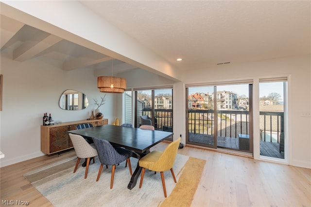 dining room with wood-type flooring