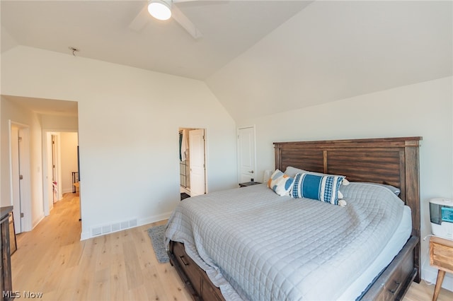 bedroom featuring vaulted ceiling, light wood-type flooring, and ceiling fan