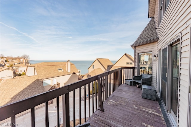 wooden deck featuring a water view