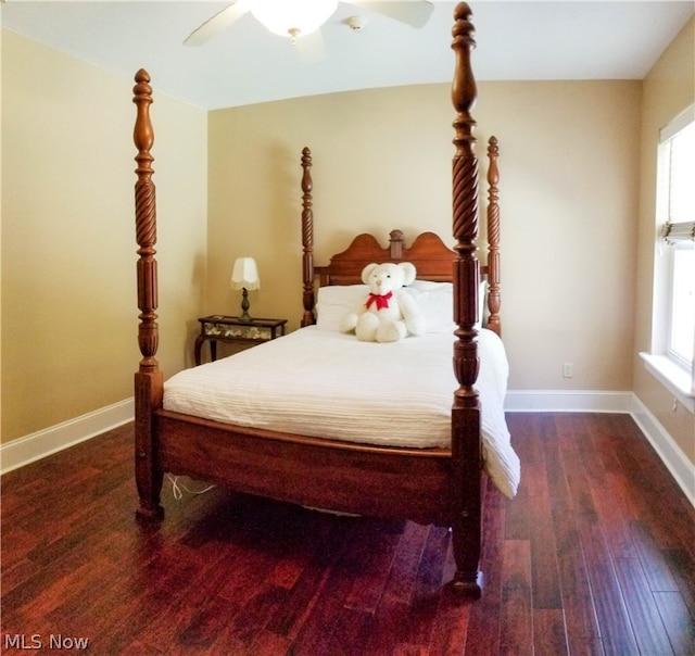 bedroom with ceiling fan and dark wood-type flooring