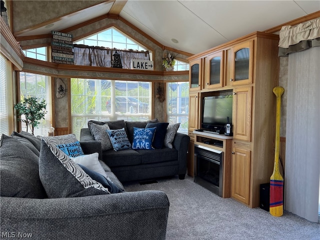 living room featuring high vaulted ceiling, light carpet, and plenty of natural light