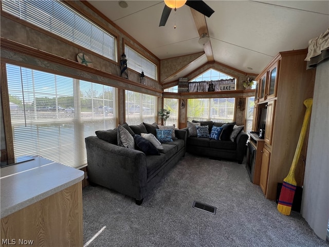 living room featuring dark carpet, high vaulted ceiling, beam ceiling, and ceiling fan