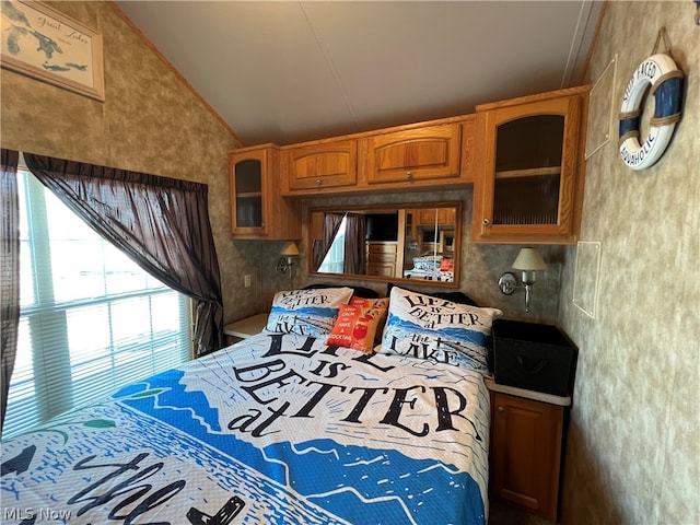 bedroom with lofted ceiling