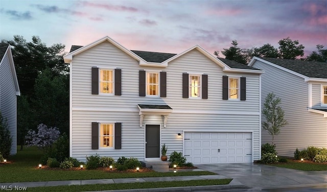 view of front of home with a garage