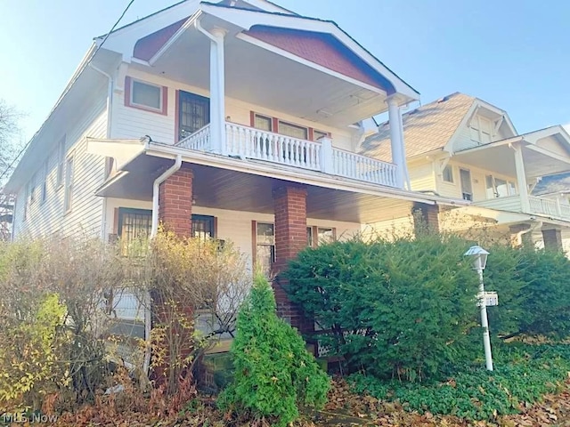 back of house with a balcony