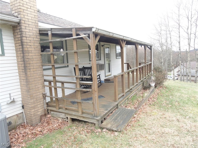 wooden terrace featuring central air condition unit