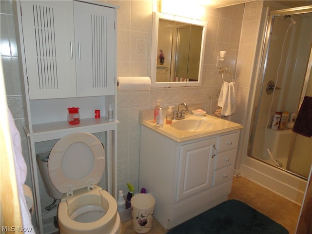 bathroom featuring tile floors, tile walls, backsplash, vanity, and toilet