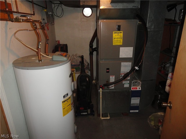 utility room featuring gas water heater