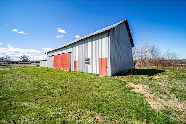 view of shed / structure featuring a lawn