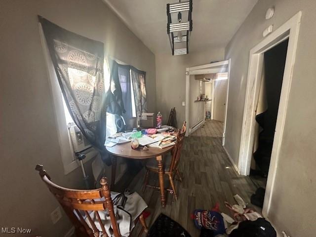 dining area featuring baseboards and wood finished floors