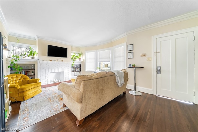 living room featuring a healthy amount of sunlight, a fireplace, and dark wood-type flooring