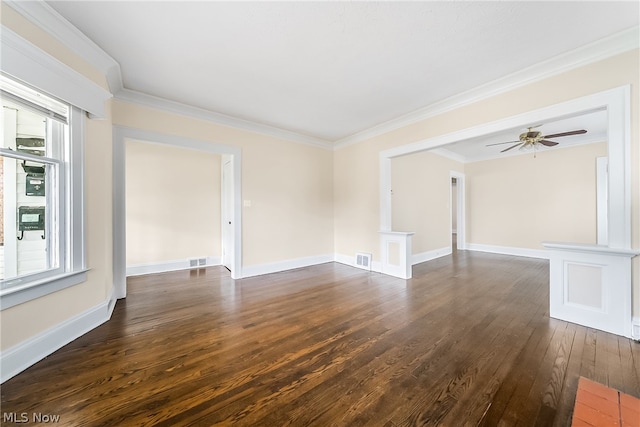 empty room featuring plenty of natural light, ceiling fan, and dark hardwood / wood-style floors