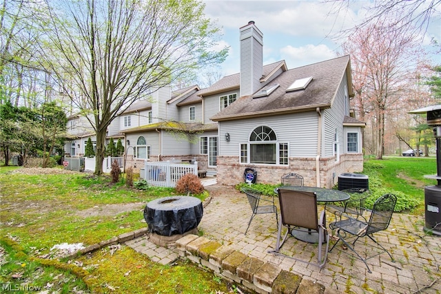 back of property with a patio and cooling unit