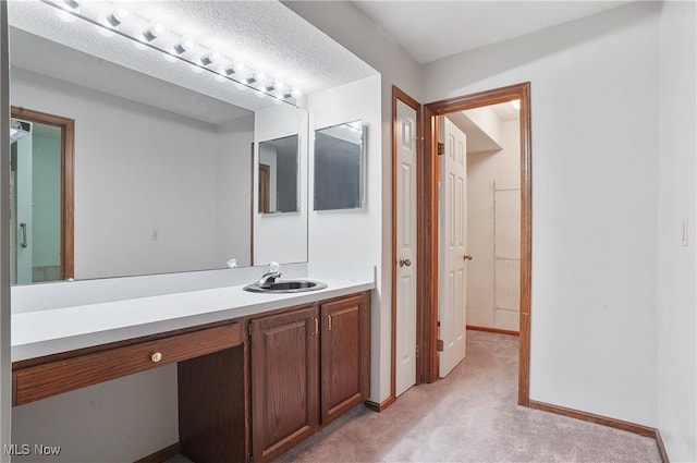 bathroom featuring vanity and a textured ceiling