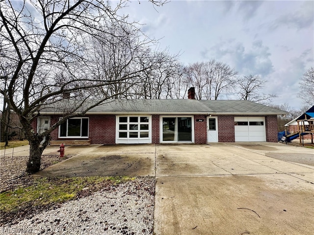 ranch-style house featuring a garage