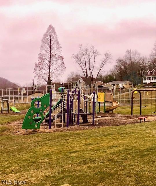 playground at dusk with a yard