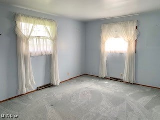 empty room featuring light colored carpet