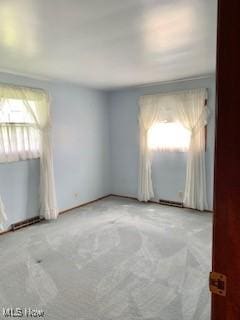 unfurnished room featuring carpet flooring