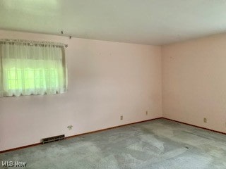 empty room featuring light colored carpet