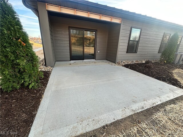 entrance to property with a patio