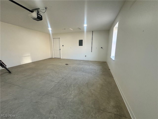 garage featuring a garage door opener and electric panel