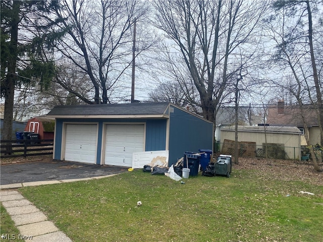 garage featuring a lawn