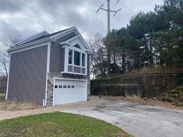 view of side of property with a garage