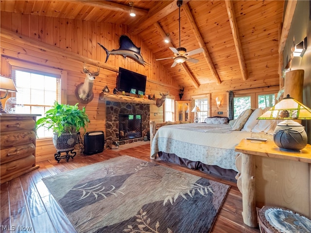 bedroom featuring wooden ceiling, beam ceiling, and wood-type flooring