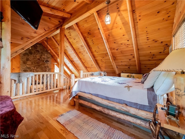 bedroom featuring wood ceiling, lofted ceiling with beams, and hardwood / wood-style floors