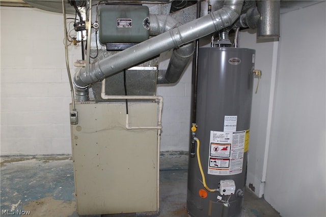 utility room featuring water heater