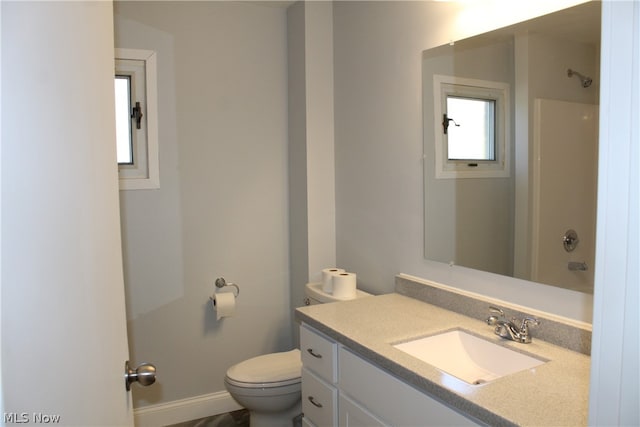 bathroom with toilet and vanity