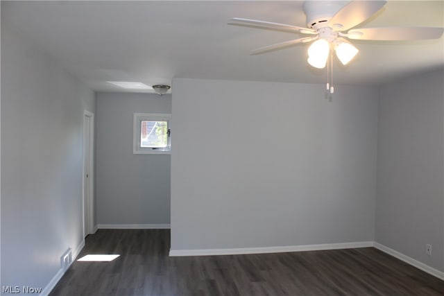 spare room with wood-type flooring and ceiling fan