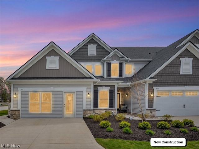 craftsman house with a garage