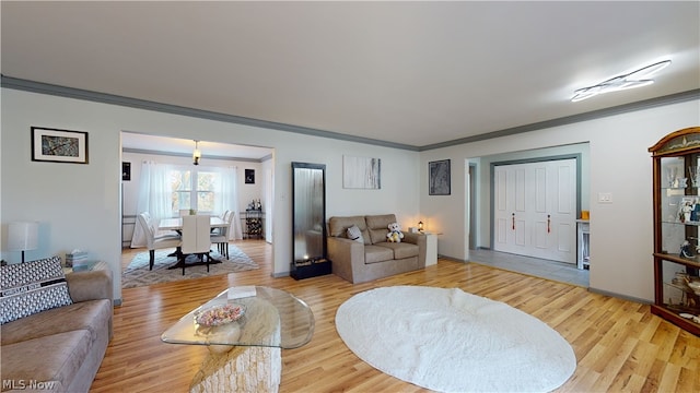 living room featuring ornamental molding and hardwood / wood-style floors