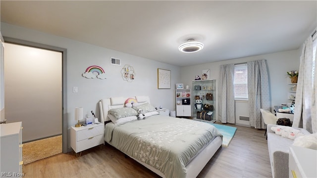 bedroom featuring light hardwood / wood-style floors