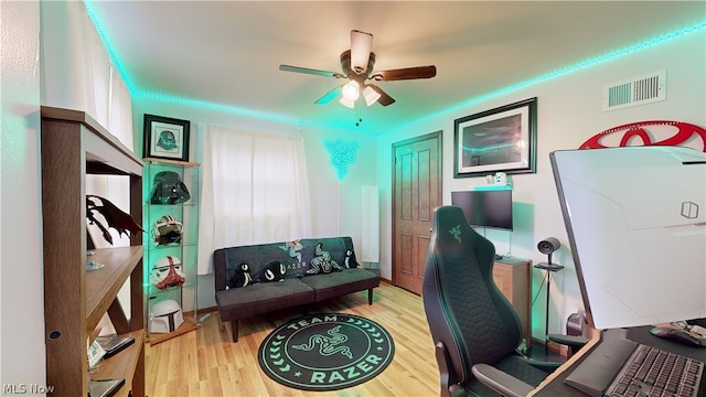 office space featuring light wood-type flooring and ceiling fan