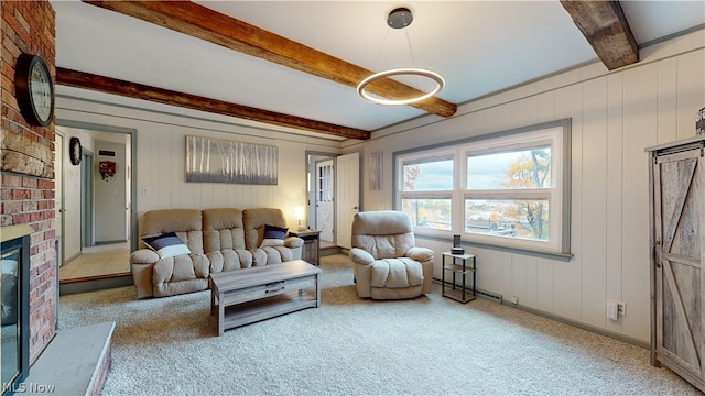 carpeted living room with a brick fireplace, wood walls, and beam ceiling