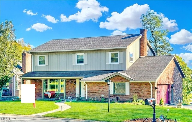 view of front of property featuring a garage and a front yard