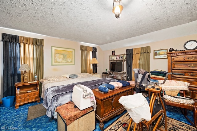 carpeted bedroom with a textured ceiling