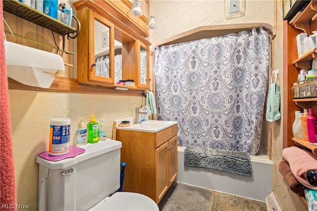 full bathroom featuring tile floors, vanity, toilet, and shower / bath combo with shower curtain