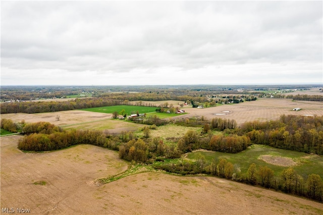 birds eye view of property with a rural view