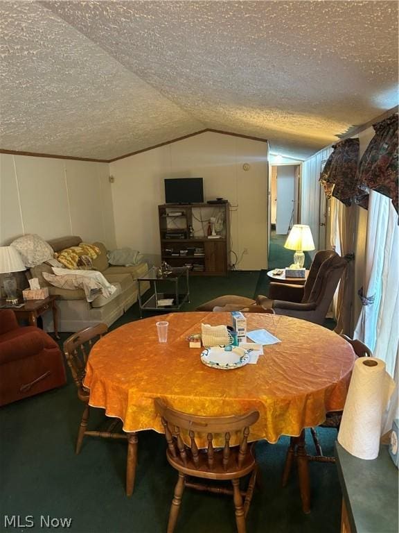 carpeted dining room with vaulted ceiling and a textured ceiling