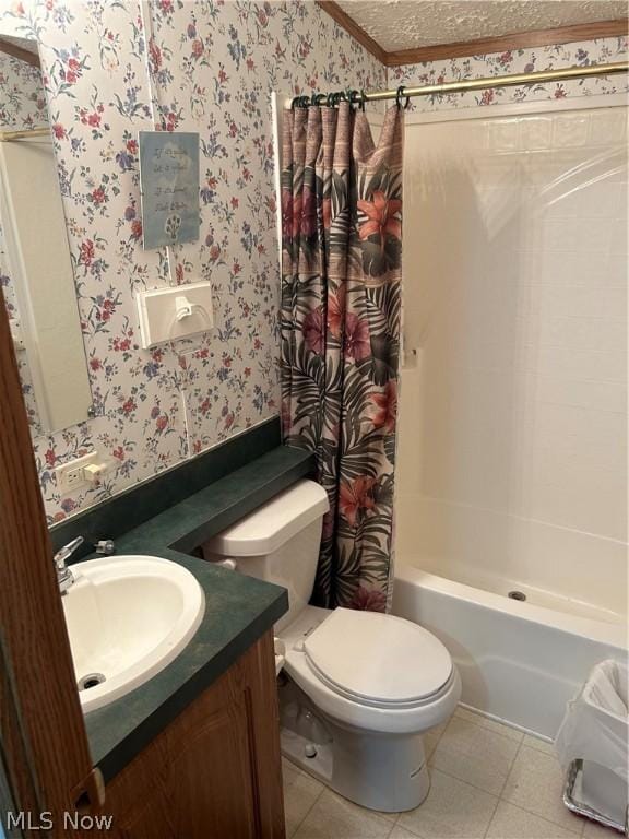 full bathroom featuring tile patterned floors, toilet, a textured ceiling, vanity, and shower / bath combo with shower curtain