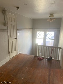 unfurnished room with hardwood / wood-style floors