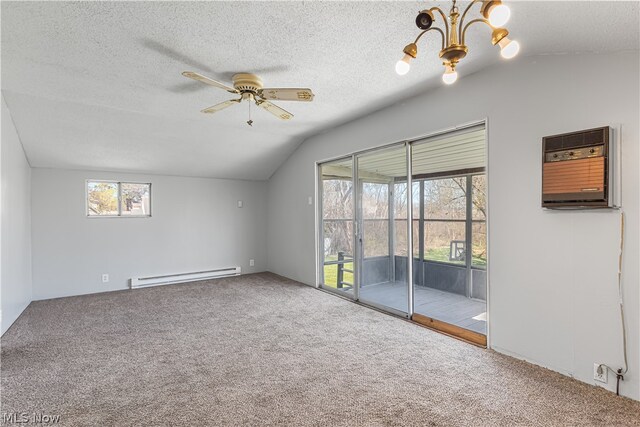 spare room with a baseboard radiator, carpet floors, vaulted ceiling, and plenty of natural light